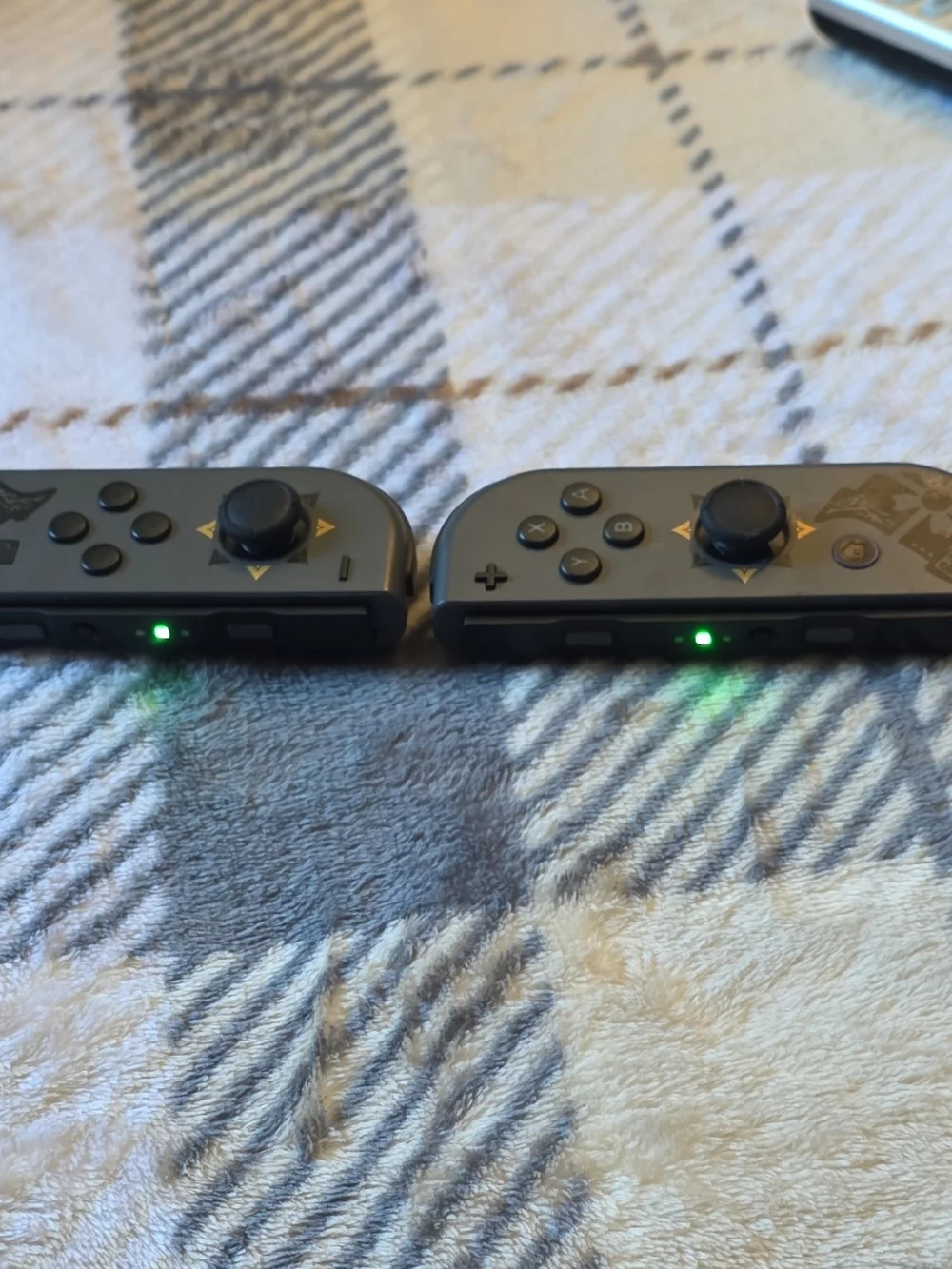 Nintendo Joy-Con Controllers in Dark Gray with Gold Accents